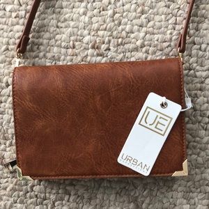 Brown purse with detachable strap.